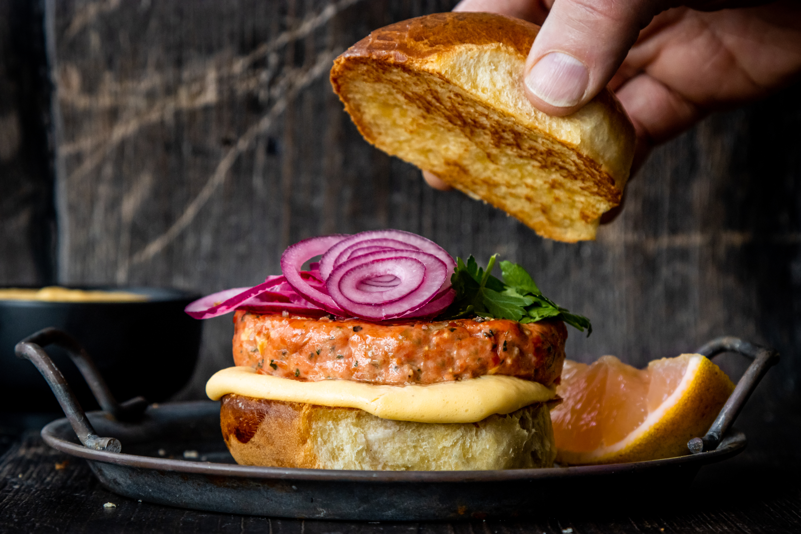 Alaska Sockeye Salmon Burger Served with a Florida Grapefruit and Tarragon Burger Sauce - Wild Alask